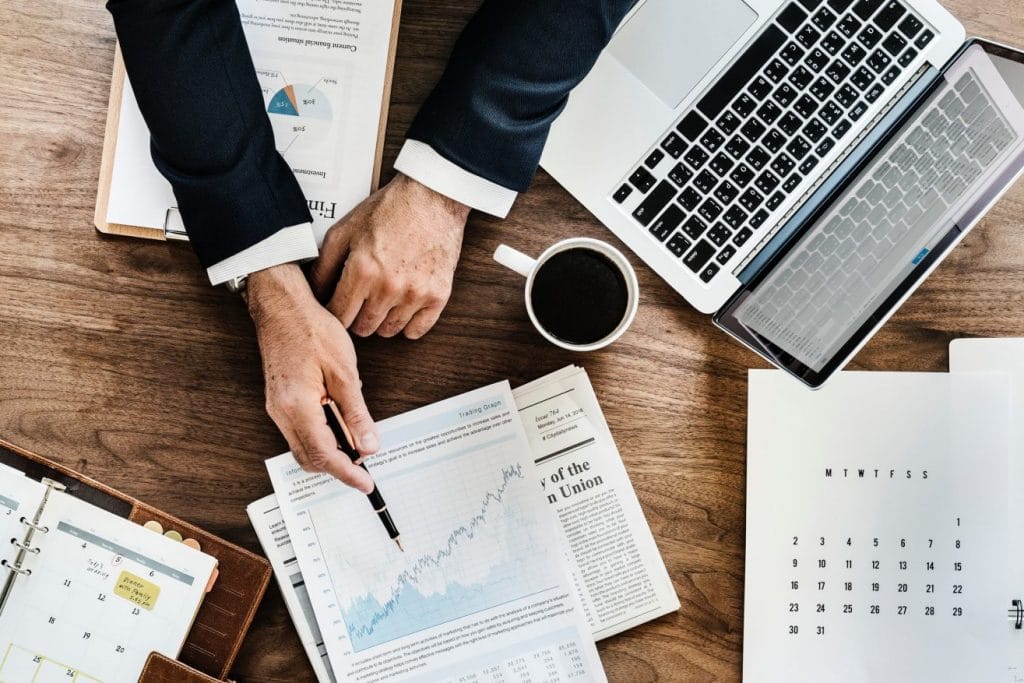 business man pointing at graph