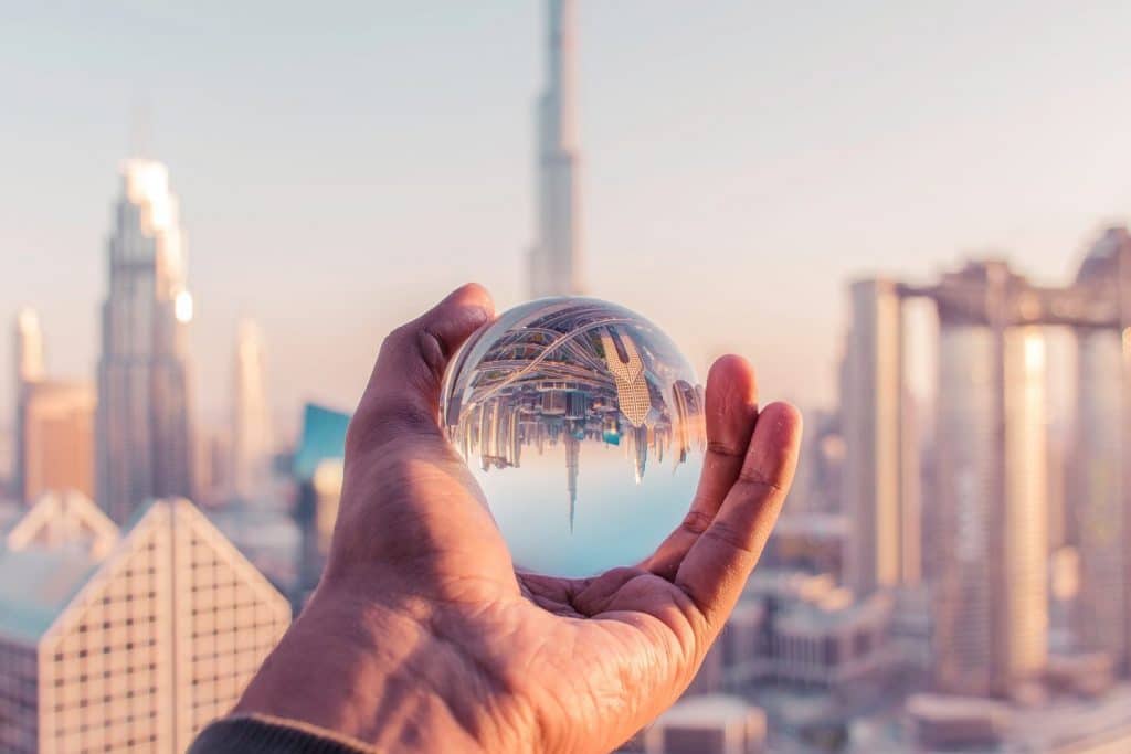 man holding glass globe