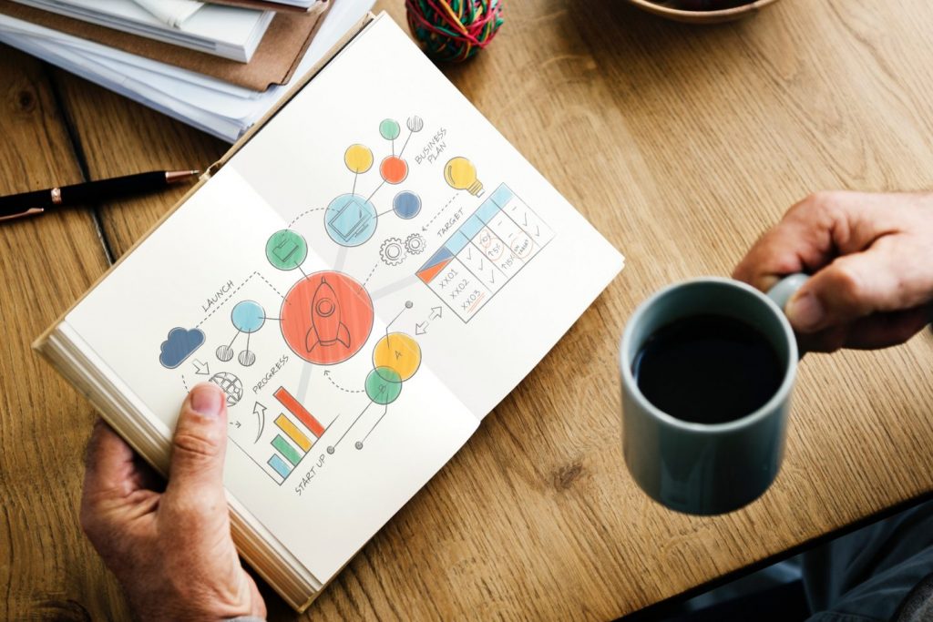 man holding coffee looking at charts / illlustration